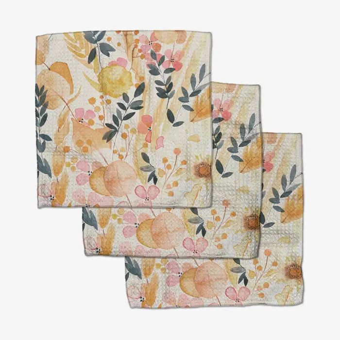 Set of three Geometry dishcloth towels with floral pattern on a white backgroun